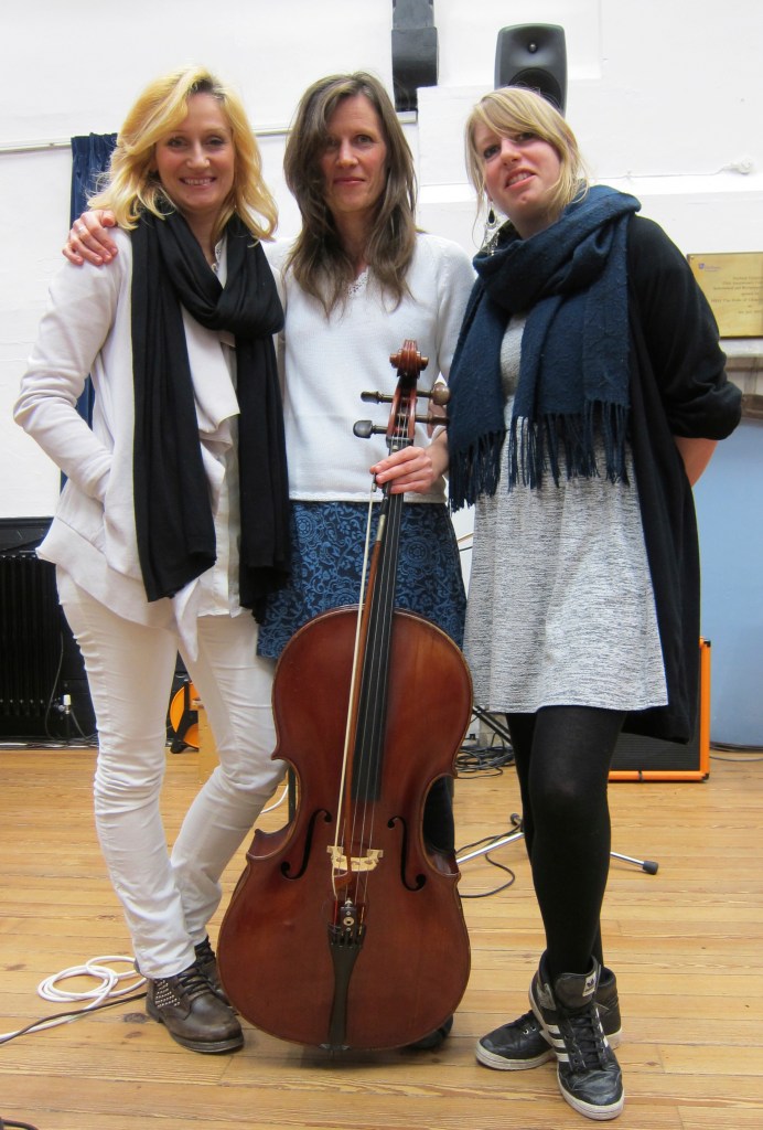 FLO team posing for photos after performance