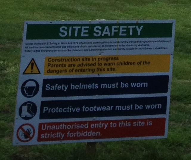 ... with her hand stretched across the courtyard under construction ...