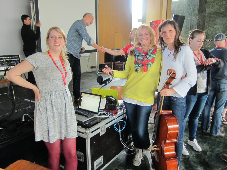 FLO team posing for the after-performance photo (Barbora checking the time and Robin getting congrats for pulling it all off in the last minute!)